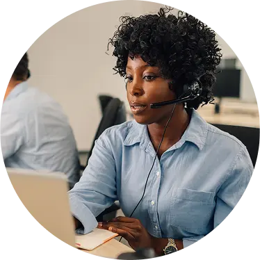 A Woman using desktop to call someone
