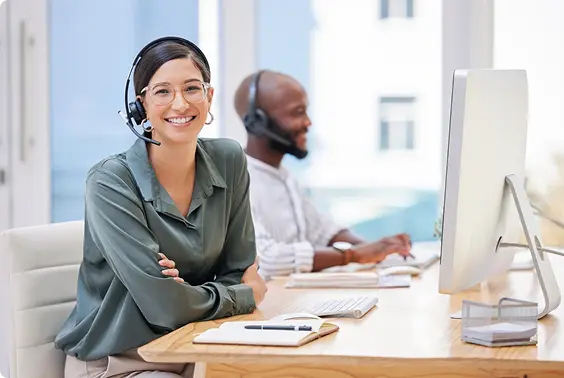 Woman on dialer with man behind blurred