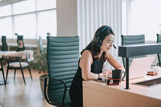 Happy Woman On Desktop conferencing call