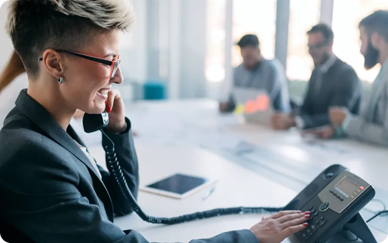 A female with her good smiling on a call using VoIP